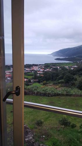 a view of the ocean from a window at Barrocas do Mar in Prainha de Baixo