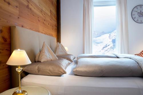 Ein Bett oder Betten in einem Zimmer der Unterkunft Hotel Bergwelt