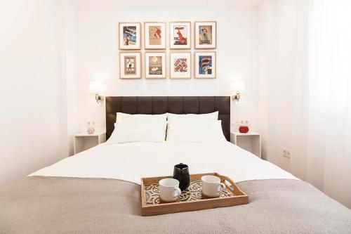 Gulta vai gultas numurā naktsmītnē Telmo FreshApartments by Bossh! Apartments