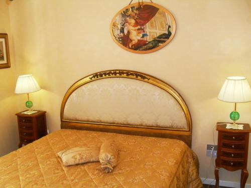 a bedroom with a bed with a pillow on it at I 13 Cavalieri Guest House in Barletta