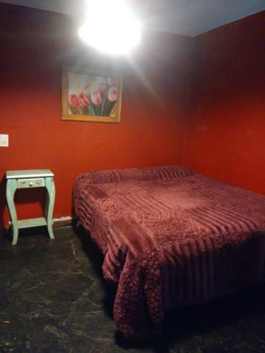 Una cama o camas en una habitación de Aldea Hippie