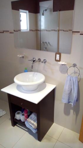 a bathroom with a sink and a mirror at San Francisco Loft in San Francisco