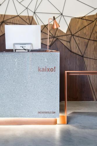 a table with a lamp on top of it at One Shot Tabakalera House in Donostia-San Sebastián