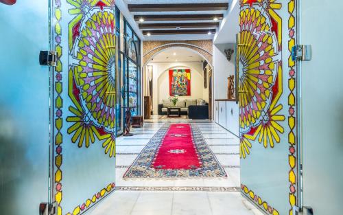 a hallway that has a rug in it at Hotel & Ryad Art Place Marrakech in Marrakech