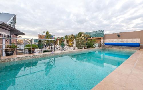 a swimming pool on the side of a building at Hotel & Ryad Art Place Marrakech in Marrakech