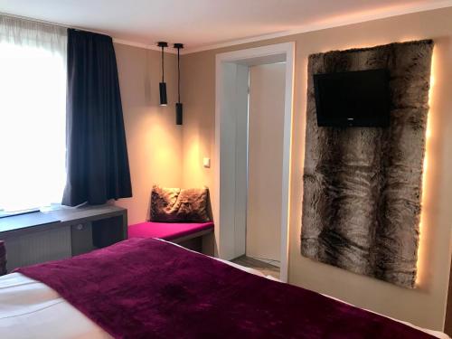 Ένα ή περισσότερα κρεβάτια σε δωμάτιο στο Romantisches Hotel Menzhausen