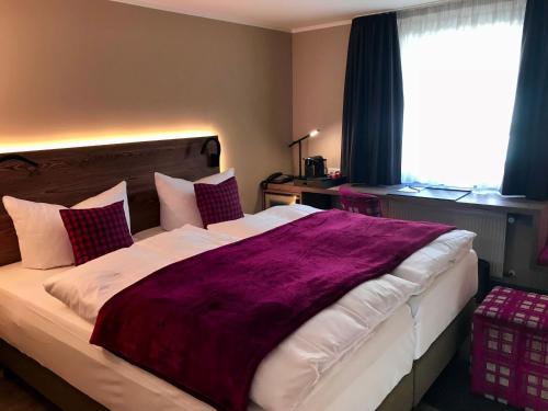 Ένα ή περισσότερα κρεβάτια σε δωμάτιο στο Romantisches Hotel Menzhausen