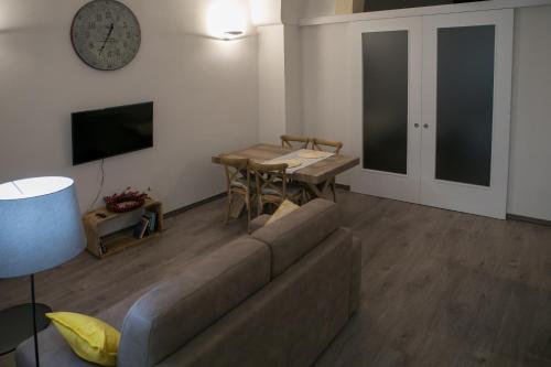 a living room with a couch and a table at Miklù Luxury Suite in Lecce