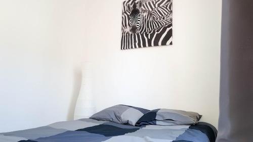 Postel nebo postele na pokoji v ubytování La plus belle de main