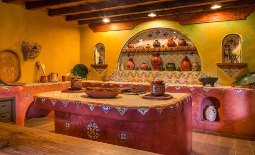 a kitchen with a table with a bowl on it at Meson de San Antonio in Pátzcuaro