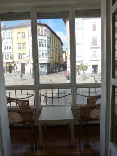 a view of a street from a window at Hostal del Arquitecto in Vitoria-Gasteiz