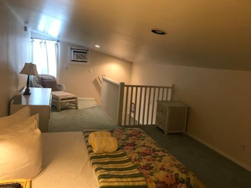 a bedroom with a bed and a desk and a chair at New Orleans House - Gay Male Adult Guesthouse in Key West