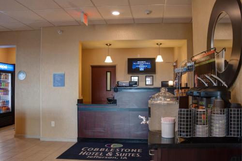 a coffee store with a counter in a store at Cobblestone Hotel and Suites - Jefferson in Jefferson