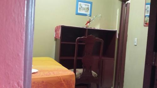 a bedroom with a bed and a dresser in a room at B&B KeisyAlba Punta Rucia in Punta Rucia