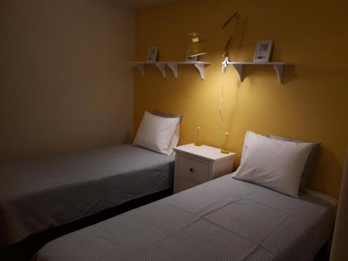 two beds sitting next to each other in a room at Stay @Airport in Lisbon