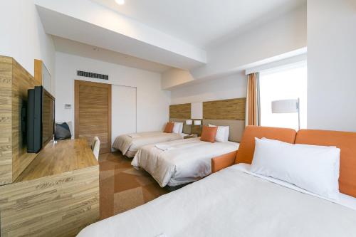Un ou plusieurs lits dans un hébergement de l'établissement Sotetsu Fresa Inn Nagano-Zenkojiguchi