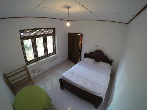 Postel nebo postele na pokoji v ubytování Bimanjee Mango Resort