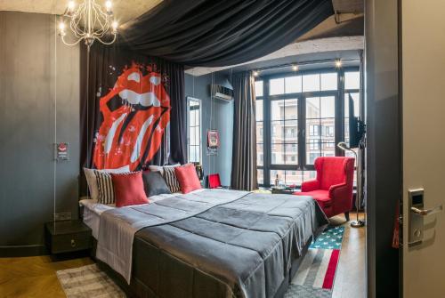 Säng eller sängar i ett rum på Design-hotel Rooms and Rumors
