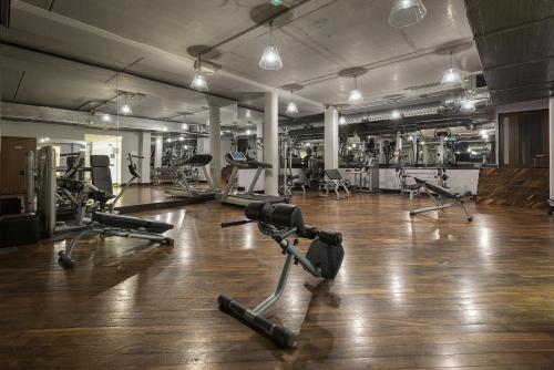 a gym with several exercise bikes and treadmills at Maloves Resort & Spa in Władysławowo