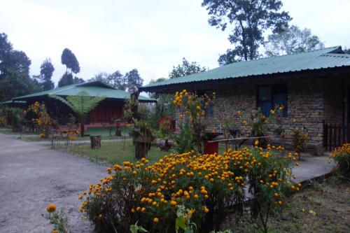 a brick house with flowers in front of it at The Barfung Retreat in Gangtok