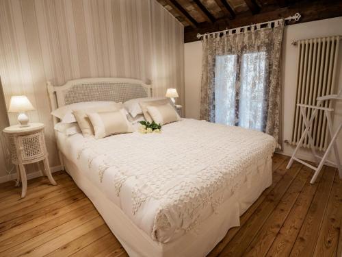 Postel nebo postele na pokoji v ubytování Accademia al Colle
