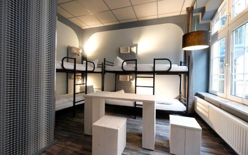 Postel nebo postele na pokoji v ubytování Singer109 Hostel, Hotel & Apartment