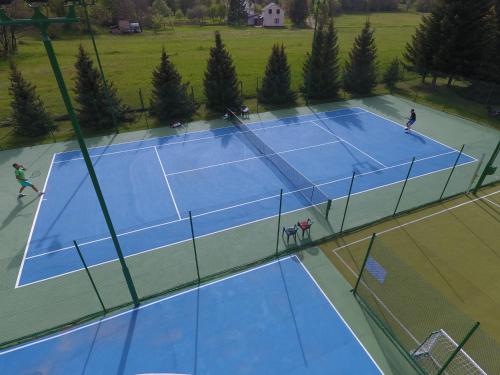 an overhead view of two tennis courts at Holiday Resort Zlatni Dol Mostar in Goranci