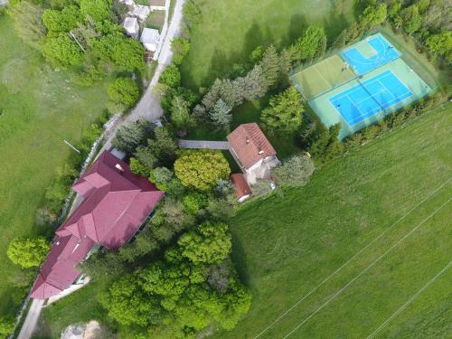an overhead view of a house and a swimming pool at Holiday Resort Zlatni Dol Mostar in Goranci