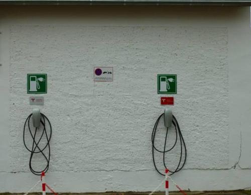 a white wall with signs and wires on it at Romantik Hotel am Brühl in Quedlinburg