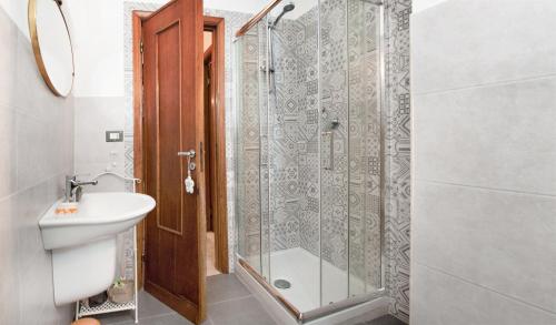 a bathroom with a shower and a toilet and a sink at Le stanze di Bruno in Pescara