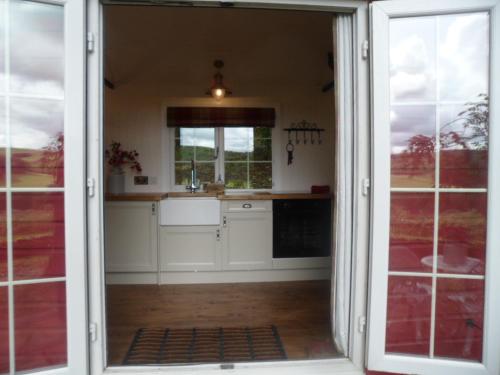 A kitchen or kitchenette at Borthwickbrae Shepherd's Hut