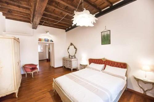 מיטה או מיטות בחדר ב-La Barca di Armida
