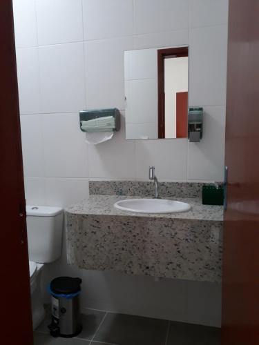 a bathroom with a sink and a toilet at Pousada Convento da Conceição in Olinda