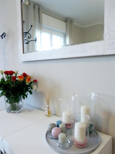 a plate with eggs and candles on a counter with a mirror at IL CILIEGIO Affittacamere in Stresa