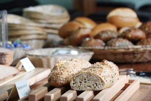 a display of bread and pastries on a table at AKZENT Hotel Altes Casino in Fulda