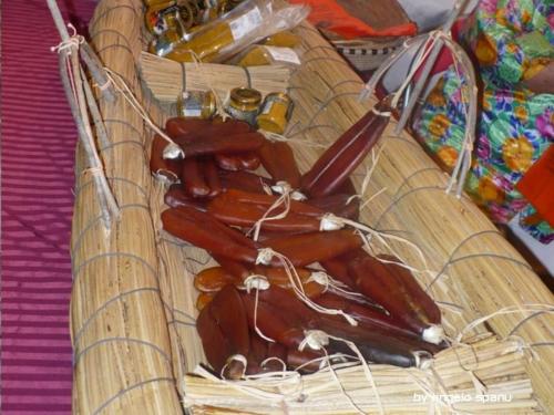 a basket full of hot dogs sitting on a table at Agriturismo Sa Ruda in Càbras