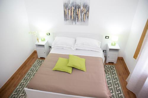 Giường trong phòng chung tại Oltremare appartamenti