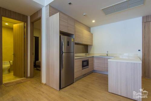 Kuchyň nebo kuchyňský kout v ubytování Baan Mai Khao Condominium