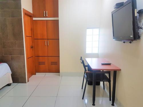 TV a/nebo společenská místnost v ubytování Hotel Murali - Cerca del Aeropuerto de Guayaquil