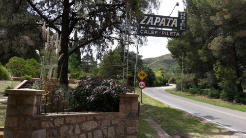 a street sign on the side of a road at Hotel Zapata in La Cumbre
