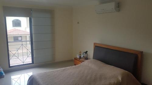 เตียงในห้องที่ Ciudad Celeste House