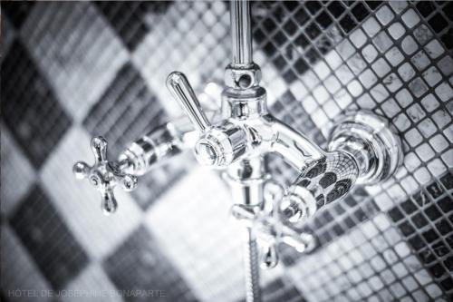 a close up of a bathroom sink faucet at Hôtel de Joséphine BONAPARTE in Paris