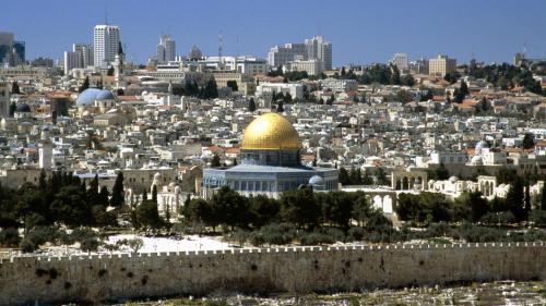 a view of the city of jerusalem with the dome of the rock at Palm Hostel in Jerusalem