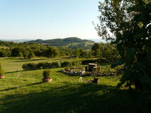 a view from the garden of a farmhouse at Il Borgo Del Lupo Relax Family Apartments in Tuscany with Restaurant & Swimming Pool in Sarteano