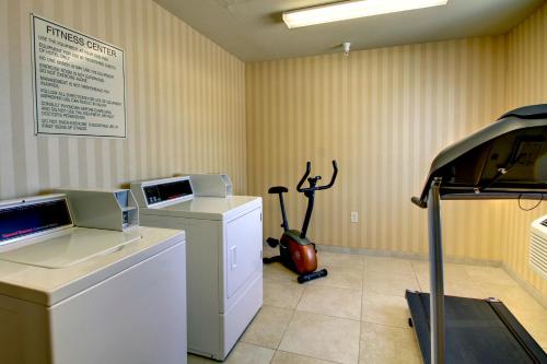 a room with a moped in the corner of a room at Cobblestone Inn & Suites - Carrington in Carrington
