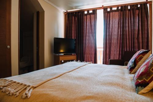 Hotel Chalet Vallugaにあるベッド