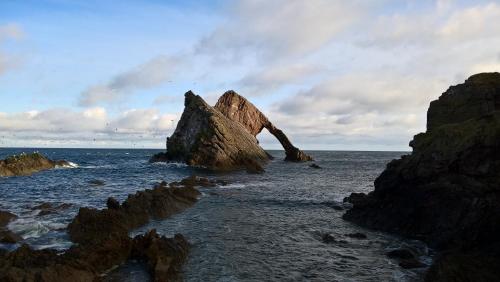 a rock formation in the water near the ocean at Cardhu Country House in Aberlour