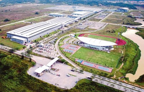 an aerial view of a large building with a soccer field at Hotel Tanjong in Tanjung Malim