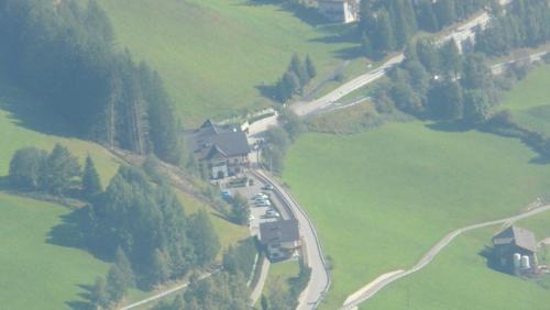an aerial view of a house on a hill at Hotel Kranebitt in Val di Vizze