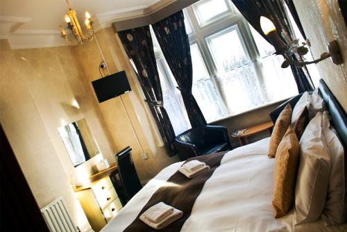 Cama o camas de una habitación en Woodthorpe Hotel